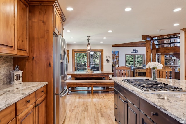 3321 W Big Spruce Way Unit E54, Park City, UT 84098 - kitchen featuring stainless steel appliances, recessed lighting, healthy amount of natural light, light wood-style floors, and light stone counters