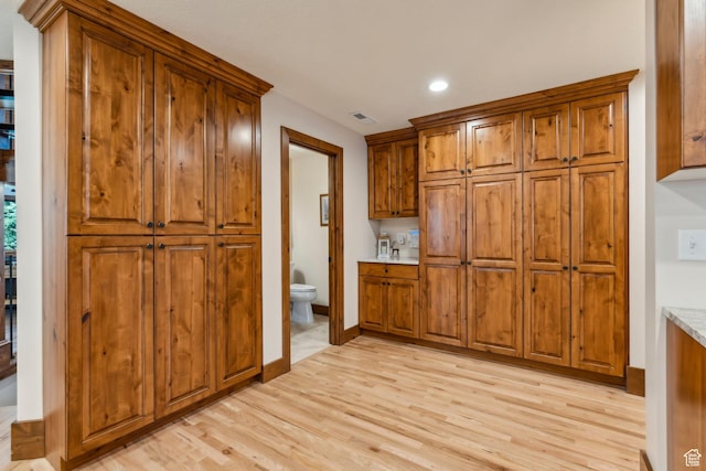 3321 W Big Spruce Way Unit E54, Park City, UT 84098 - kitchen featuring brown cabinetry, light wood-style flooring, recessed lighting, and baseboards