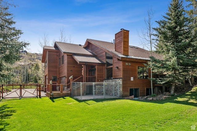 3321 W Big Spruce Way Unit E54, Park City, UT 84098 - rear view of house with a patio, a chimney, roof with shingles, and a gate