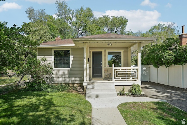 2597 S Elizabeth St, Salt Lake City, UT 84106 - bungalow-style house with a porch and a chimney