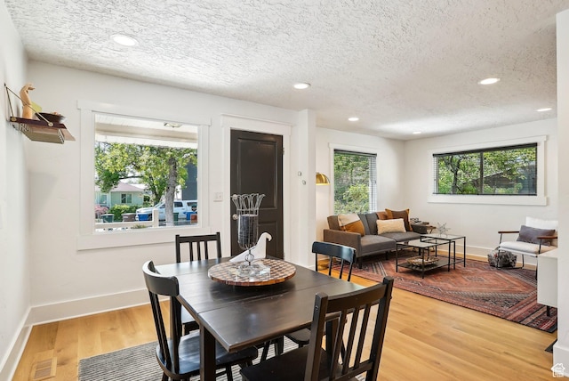 2597 S Elizabeth St, Salt Lake City, UT 84106 - dining space with a textured ceiling, healthy amount of natural light, light wood-type flooring, recessed lighting, and baseboards