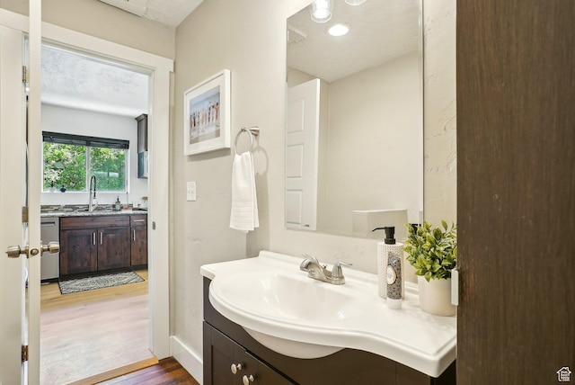 2597 S Elizabeth St, Salt Lake City, UT 84106 - bathroom with wood finished floors, vanity, and baseboards