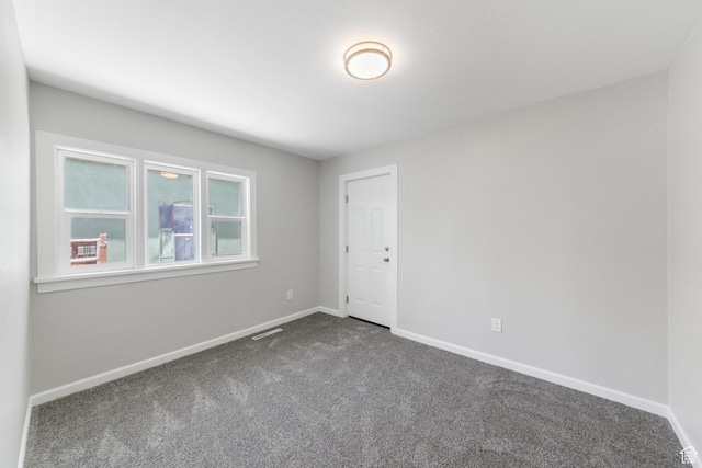 63 E 100 S, Nephi, UT 84648 - empty room featuring dark colored carpet and baseboards