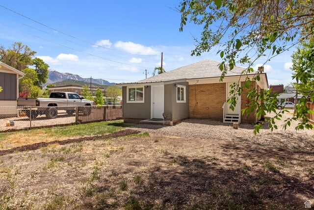 63 E 100 S, Nephi, UT 84648 - rear view of house with a mountain view and fence