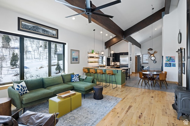 10256 N Basin Canyon Rd, Park City, UT 84098 - living area featuring light wood-style flooring, a ceiling fan, recessed lighting, a wood stove, and high vaulted ceiling