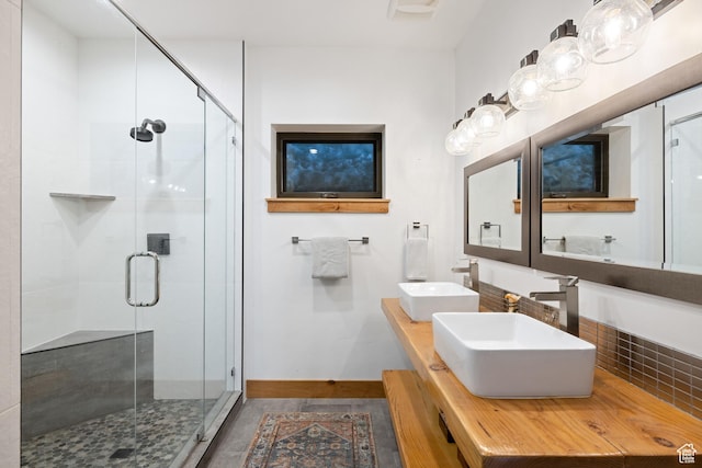 10256 N Basin Canyon Rd, Park City, UT 84098 - bathroom with a stall shower, double vanity, and baseboards