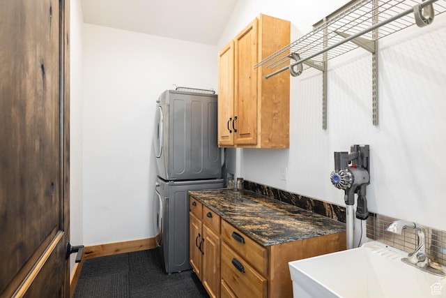 10256 N Basin Canyon Rd, Park City, UT 84098 - washroom featuring stacked washer / drying machine and cabinet space
