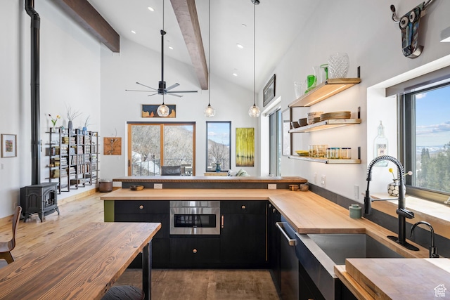 10256 N Basin Canyon Rd, Park City, UT 84098 - kitchen featuring a sink, wooden counters, dark cabinets, wood finished floors, and beamed ceiling