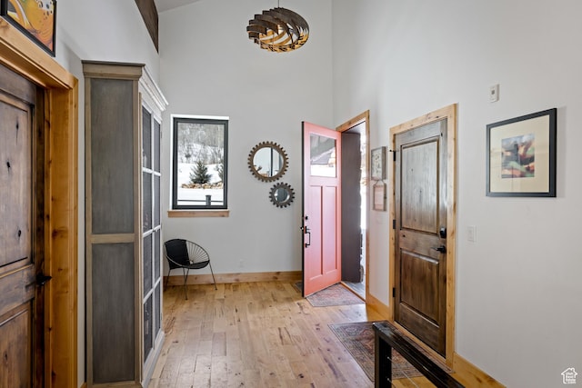 10256 N Basin Canyon Rd, Park City, UT 84098 - foyer with light wood-type flooring, a high ceiling, and baseboards