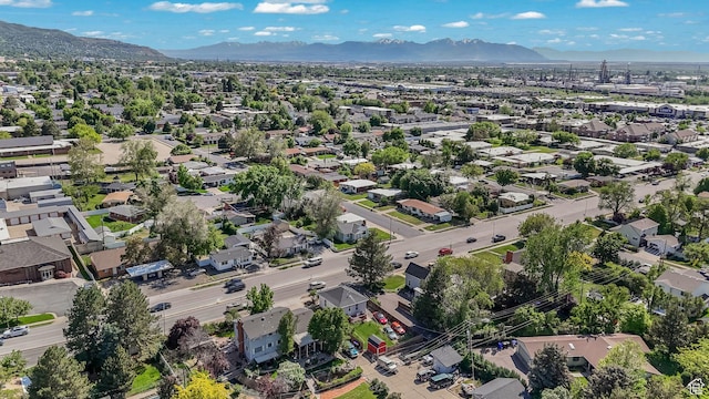 aerial view of residential area featuring mountains