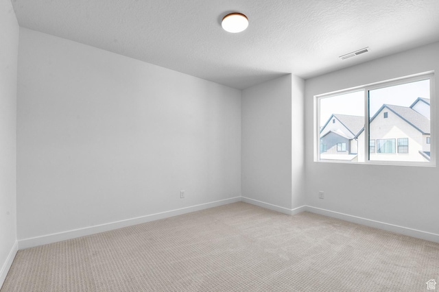 2415 N Ribe Ln, Lehi, UT 84043 - empty room with light carpet, a textured ceiling, and baseboards