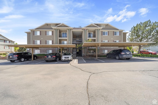 view of building exterior featuring covered parking
