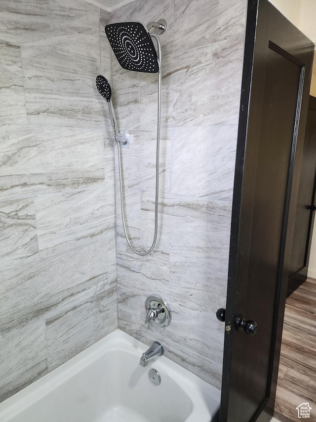 full bathroom with shower / washtub combination