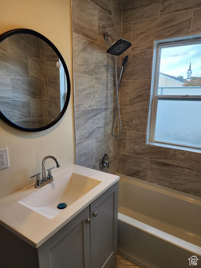 bathroom featuring vanity and bathing tub / shower combination