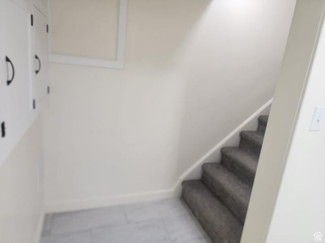 stairway with baseboards