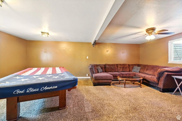 playroom with carpet, ceiling fan, and baseboards