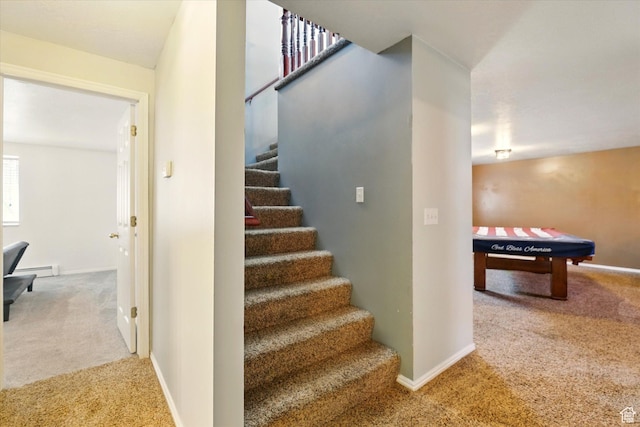 staircase with carpet flooring, baseboards, and baseboard heating