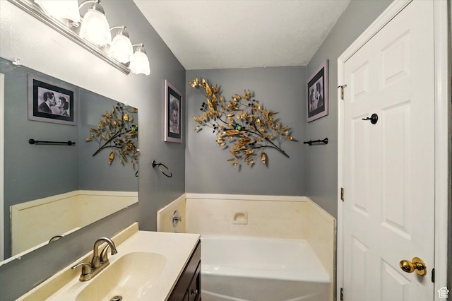full bathroom featuring a bath and vanity