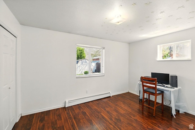 office featuring a baseboard heating unit, wood finished floors, and baseboards
