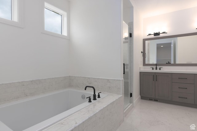 full bath featuring vanity, a stall shower, and a bath