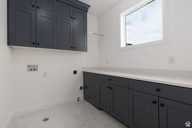 laundry area with hookup for a washing machine, light marble finish flooring, baseboards, cabinet space, and electric dryer hookup
