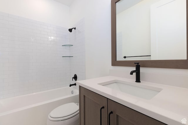 bathroom featuring toilet, vanity, and bathing tub / shower combination