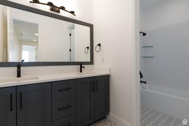 full bathroom featuring double vanity, bathing tub / shower combination, baseboards, and tile patterned floors