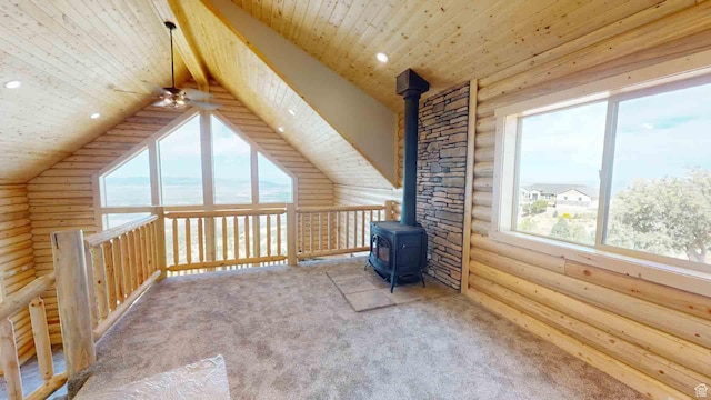 1982 S High Juniper Dr, Cedar City, UT 84720 - bonus room featuring log walls, a wood stove, healthy amount of natural light, carpet floors, and wood ceiling