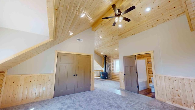 1982 S High Juniper Dr, Cedar City, UT 84720 - additional living space featuring a wood stove, wainscoting, carpet flooring, recessed lighting, and ceiling fan
