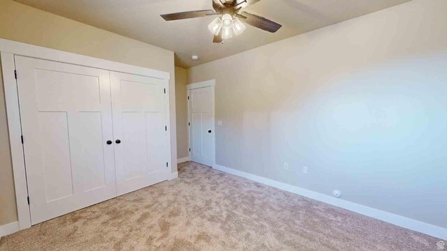 1982 S High Juniper Dr, Cedar City, UT 84720 - unfurnished bedroom with light carpet, baseboards, a closet, and a ceiling fan