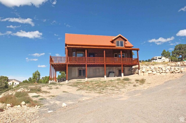 1982 S High Juniper Dr, Cedar City, UT 84720 - rear view of house with a deck and metal roof