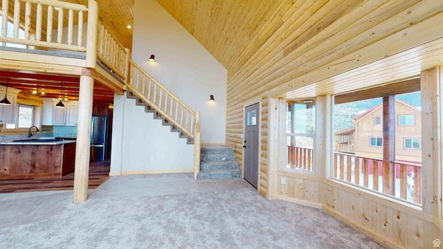 1982 S High Juniper Dr, Cedar City, UT 84720 - unfurnished living room featuring stairway, carpet floors, high vaulted ceiling, and wood ceiling