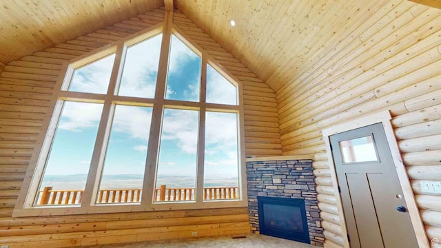 1982 S High Juniper Dr, Cedar City, UT 84720 - unfurnished living room featuring log walls, a high ceiling, wood ceiling, and a stone fireplace