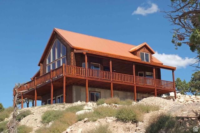 1982 S High Juniper Dr, Cedar City, UT 84720 - back of house with a deck, log siding, and metal roof