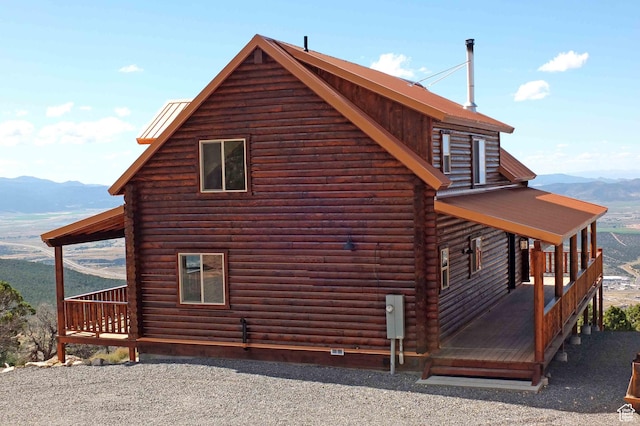 1982 S High Juniper Dr, Cedar City, UT 84720 - view of side of property with log siding and a mountain view