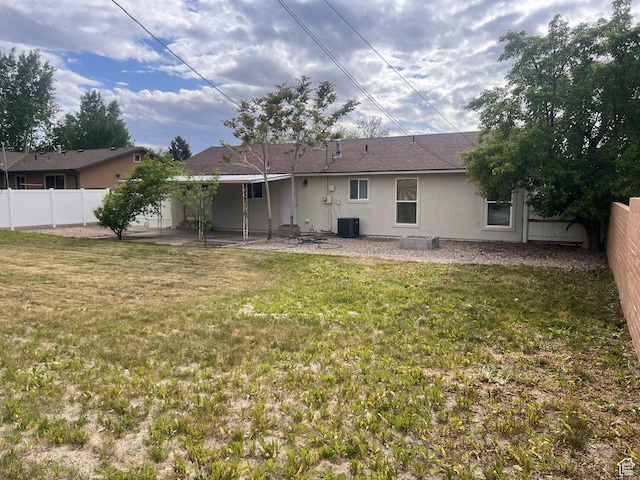 back of property featuring stucco siding, central air condition unit, and a patio area