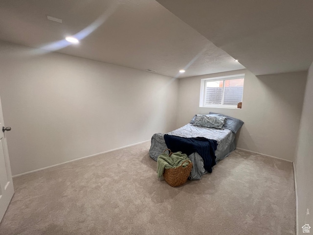 carpeted bedroom with vaulted ceiling, recessed lighting, and baseboards