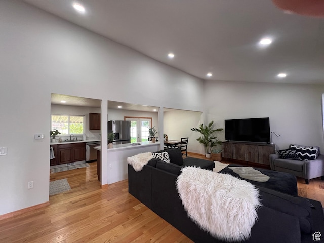 living room with recessed lighting and light wood-type flooring