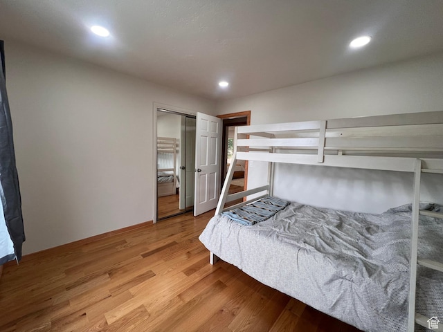 bedroom featuring light wood-style floors and recessed lighting