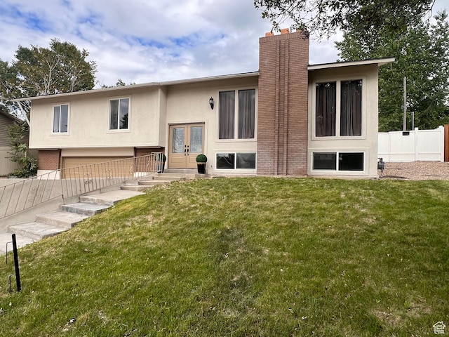 back of house featuring stucco siding, french doors, and a chimney