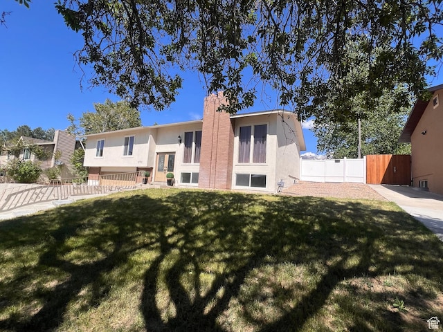 8793 S 1595 E, Sandy, UT 84093 - back of house featuring stucco siding and a chimney