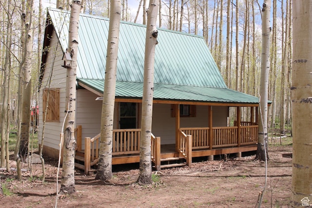 view of front of home with covered porch and metal roof