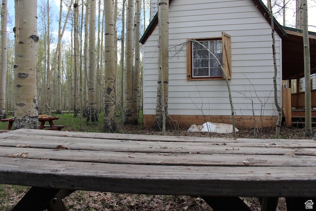 view of home's exterior with a wooden deck