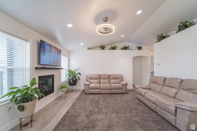 320 E 100 N, Manti, UT 84642 - living room featuring lofted ceiling, a fireplace, recessed lighting, light wood-style floors, and arched walkways