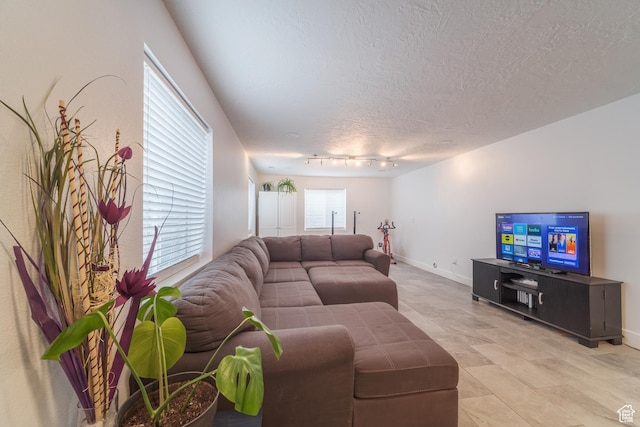 320 E 100 N, Manti, UT 84642 - living area with a textured ceiling, track lighting, and baseboards