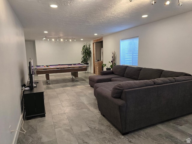living room with billiards, recessed lighting, a textured ceiling, and baseboards