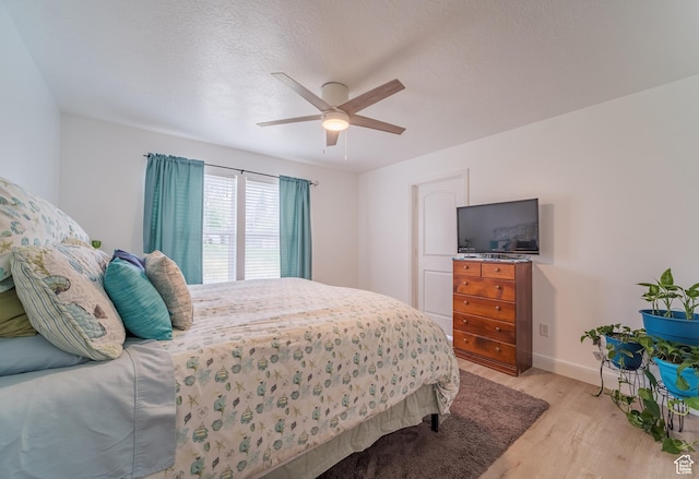 320 E 100 N, Manti, UT 84642 - bedroom with light wood-type flooring, baseboards, and a ceiling fan