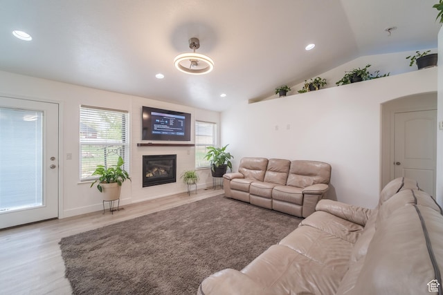 320 E 100 N, Manti, UT 84642 - living room featuring vaulted ceiling, wood finished floors, a glass covered fireplace, and recessed lighting
