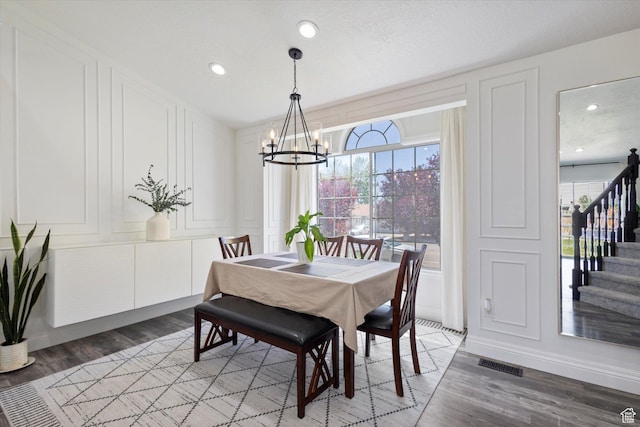 4962 S Glasmann Way S, Ogden, UT 84403 - dining space featuring a chandelier, a decorative wall, plenty of natural light, light wood-style floors, and recessed lighting