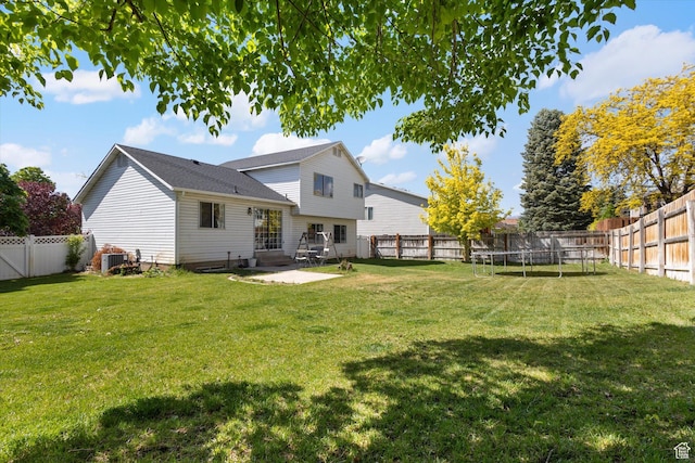 4962 S Glasmann Way S, Ogden, UT 84403 - rear view of house with a trampoline, central AC, and a patio